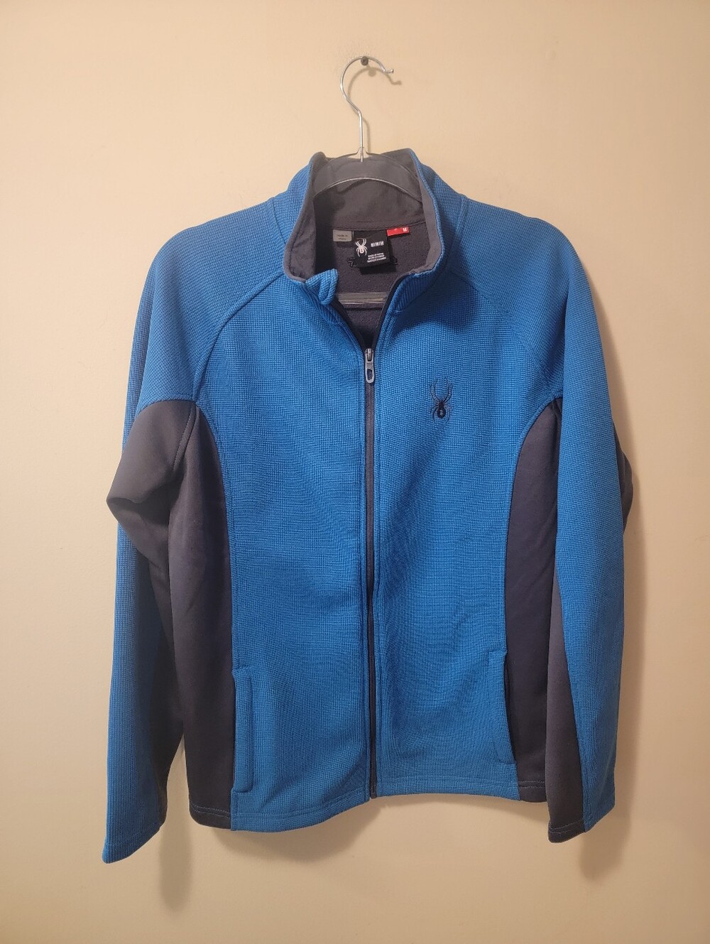 Stay warm and comfortable with this Spyder full-zip performance jacket.